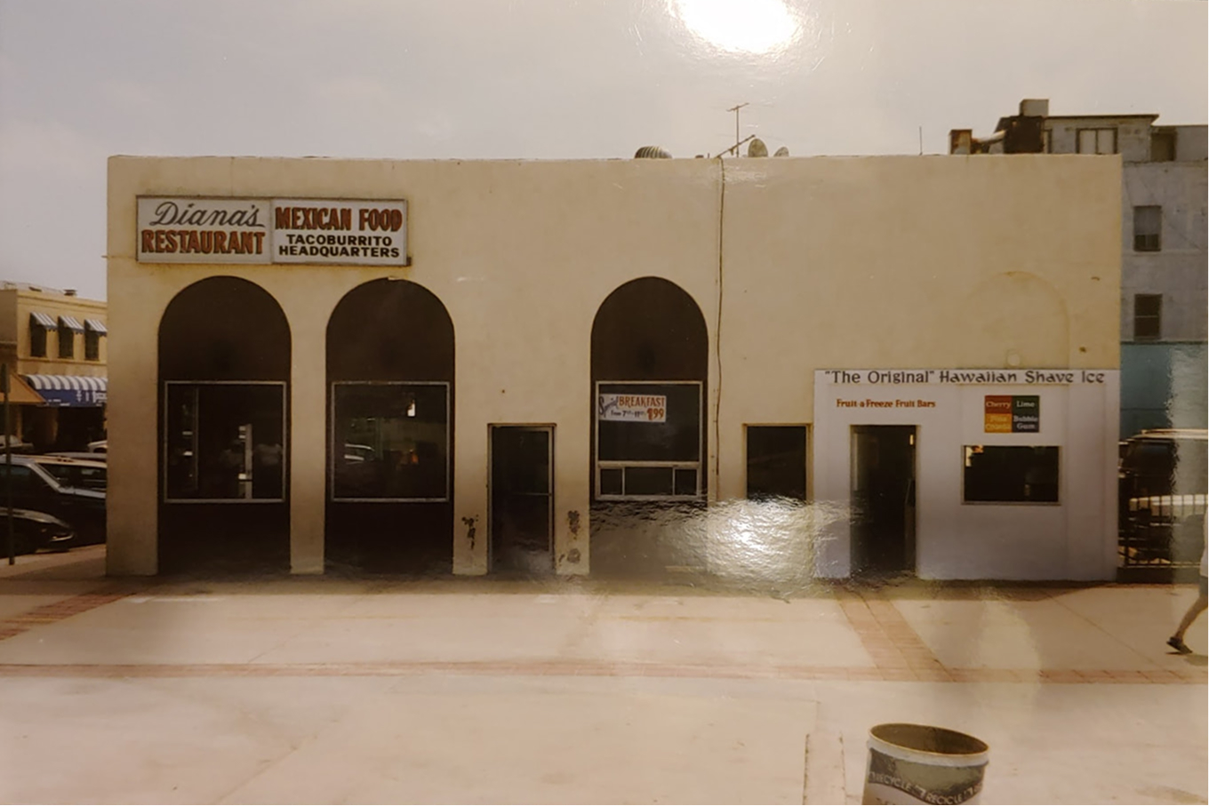 The original Diana's Restaurant building with arched doorways and Tacoburrito Headquarters sign