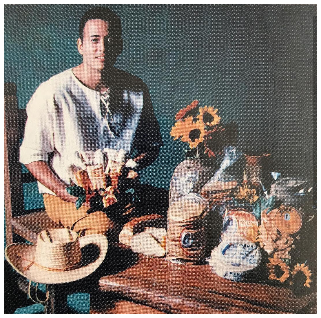 A vintage Diana's product display with tamales, tortillas and fresh flowers